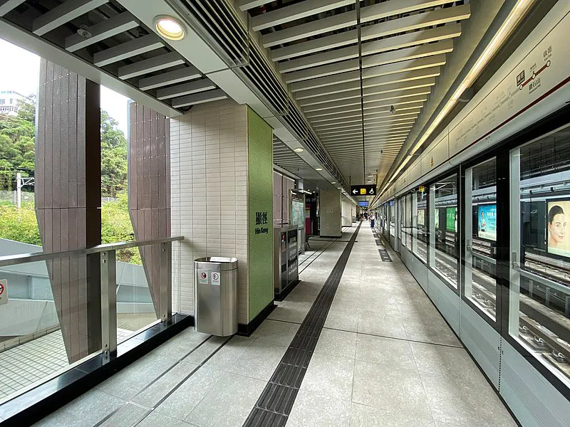 Clean and modern train station platform with safety doors and minimalistic design.