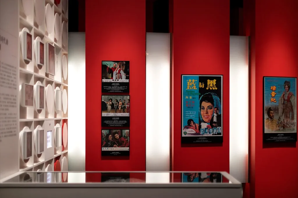 Hong Kong Heritage Museum showcases a captivating red and white display with vintage movie posters, reflecting the city's cinematic heritage and pop culture evolution.