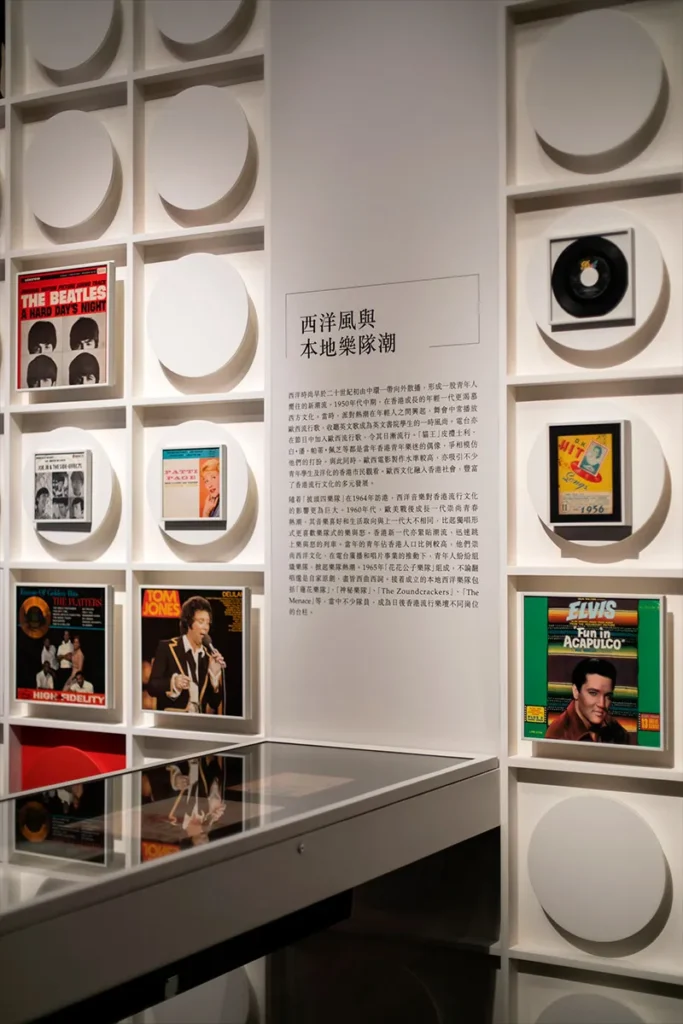 Intricate exhibit installation at the Hong Kong Heritage Museum, where iconic vinyl records and album covers celebrate the international influence of Hong Kong's pop culture.