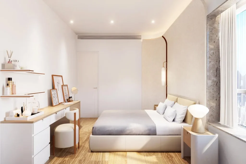 Sunlit master bedroom designed by Rebel Arkitekt, featuring a plush bed with soft linens, bespoke floating shelves, and a chic vanity area, all harmonized by the natural warmth of timber flooring and an arched feature wall.