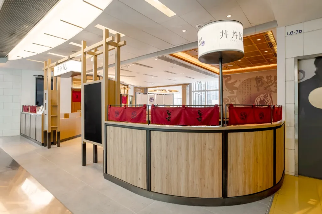 Inviting entrance of DONDONYA x TORIKAI featuring a traditional Torli gate and Chōchin lanterns, highlighting the collaboration with a design signature of Rebel Arkitekt.