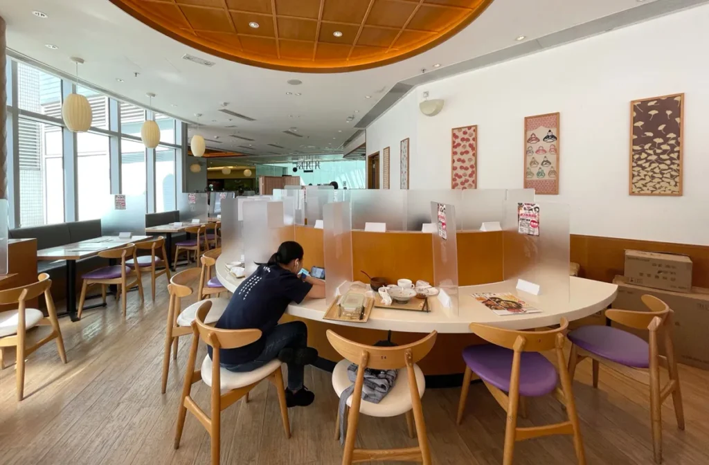 DONDONYA x TORIKAI's original dining space captures a functional design with patrons enjoying a peaceful meal under soft lantern lighting before Rebel Arkitekt's renovation.