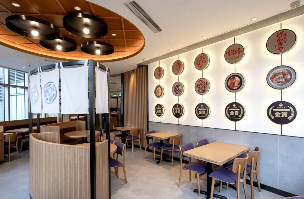 DONDONYA x TORIKAI's renovated dining space, boasting a gallery of award-winning donburi brands' trophies on an elegantly designed wall by Rebel Arkitekt.