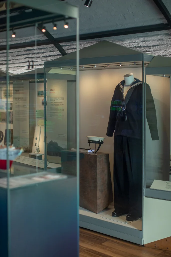 Display of a historical naval uniform at the Hong Kong Museum of Coastal Defence, highlighting maritime heritage.