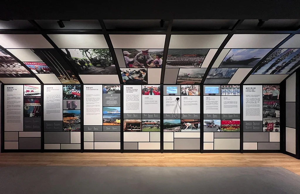 Overview of the People's Republic of China display at the Hong Kong Museum of Coastal Defence, showcasing military achievements and cooperation narratives