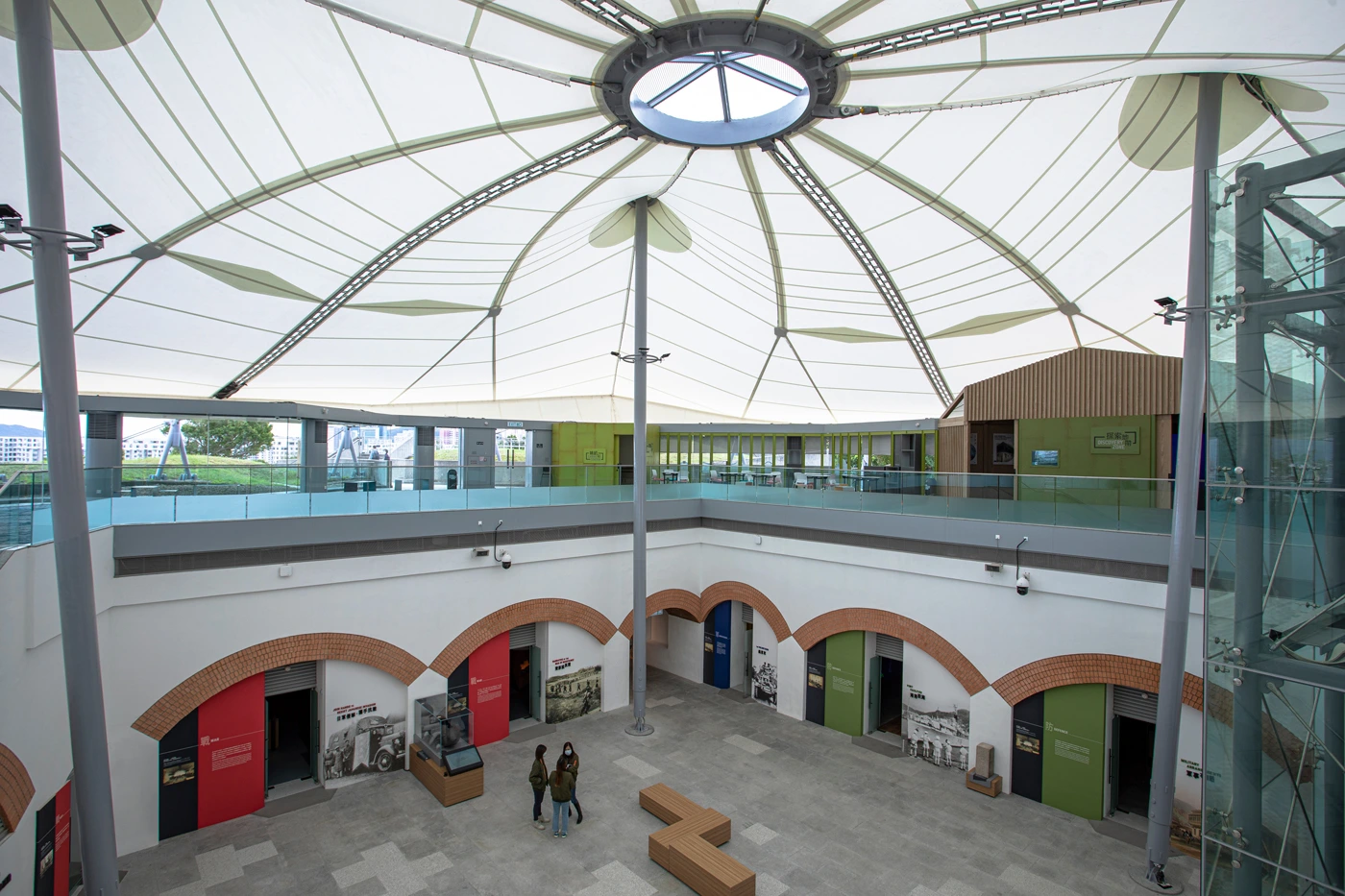 Redoubt atrium with a modern tensile roof and historical exhibition rooms at the Hong Kong Museum of Coastal Defence