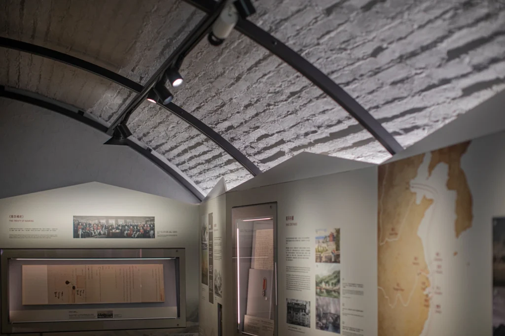 Exhibit displaying the Treaty of Nanking, featuring historical documents and related imagery at the Hong Kong Museum of Coastal Defence