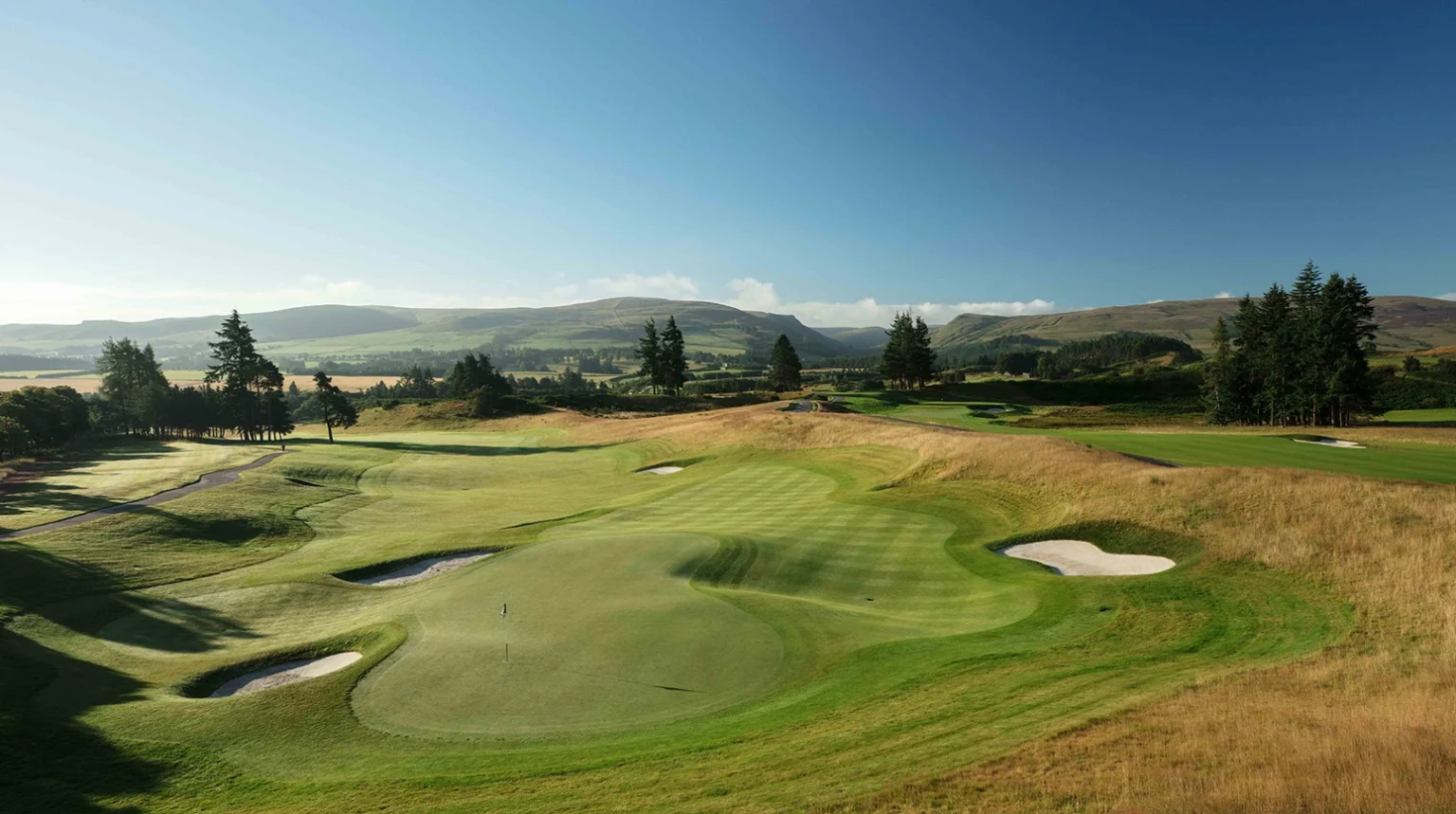 Overlooking Gleneagles PGA Centenary Course with scenic hills and bunkered greens.