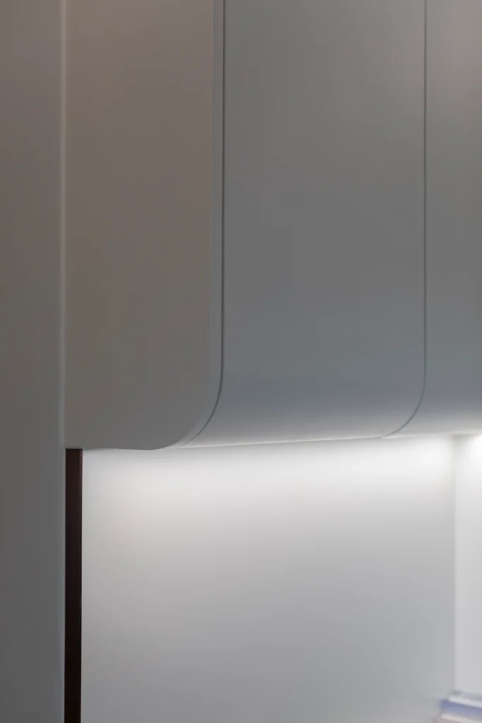 close-up of curved cabinet edge with integrated soft lighting