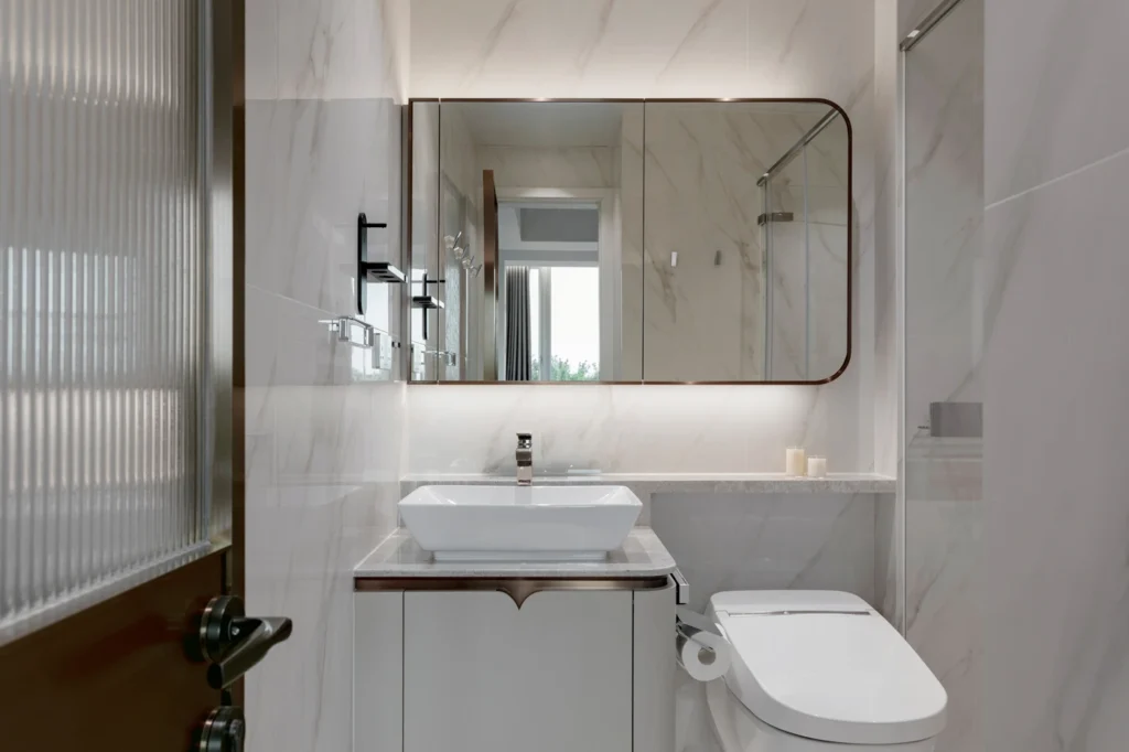 modern bathroom with marble finishes and elegant vanity